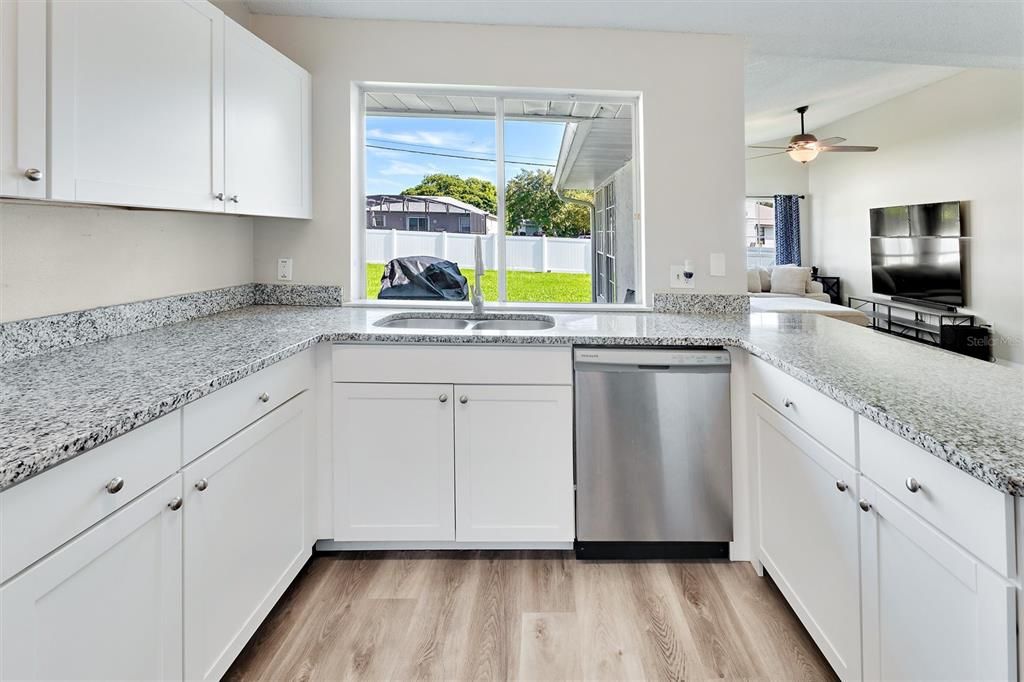 Kitchen with large window to backyard