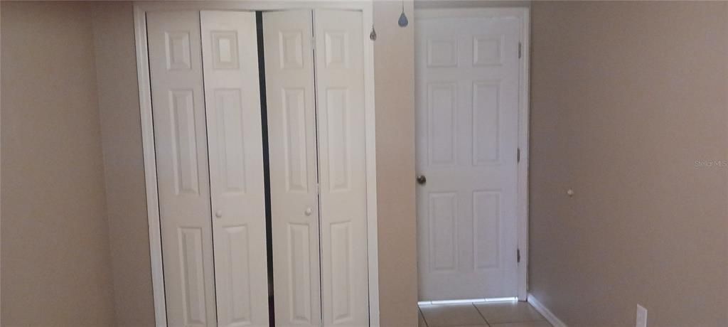 second bedroom door and closet