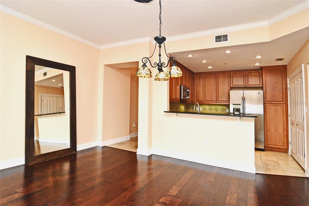 Dining Area with Kitchen in Background Pic 3