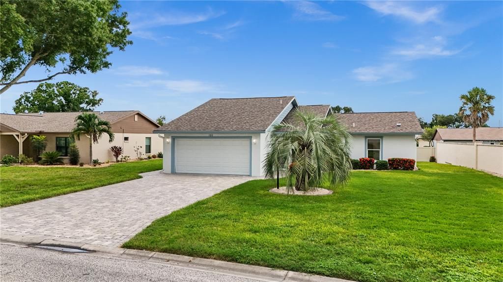 HOME HAS A PAVER DRIVEWAY AND SIDEWALKS.