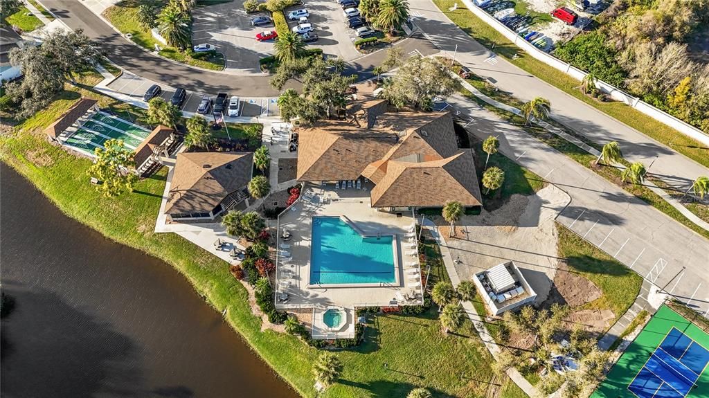 AERIAL VIEW OF THE POOL, HOT TUB AND CLUBHOUSE.