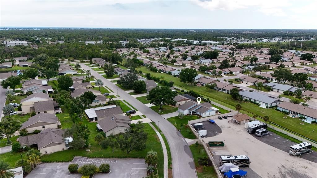 AERIAL VIEW TOWARDS THE HOME AND ADJOINING FOXWOOD NEIGHBORHOOD.