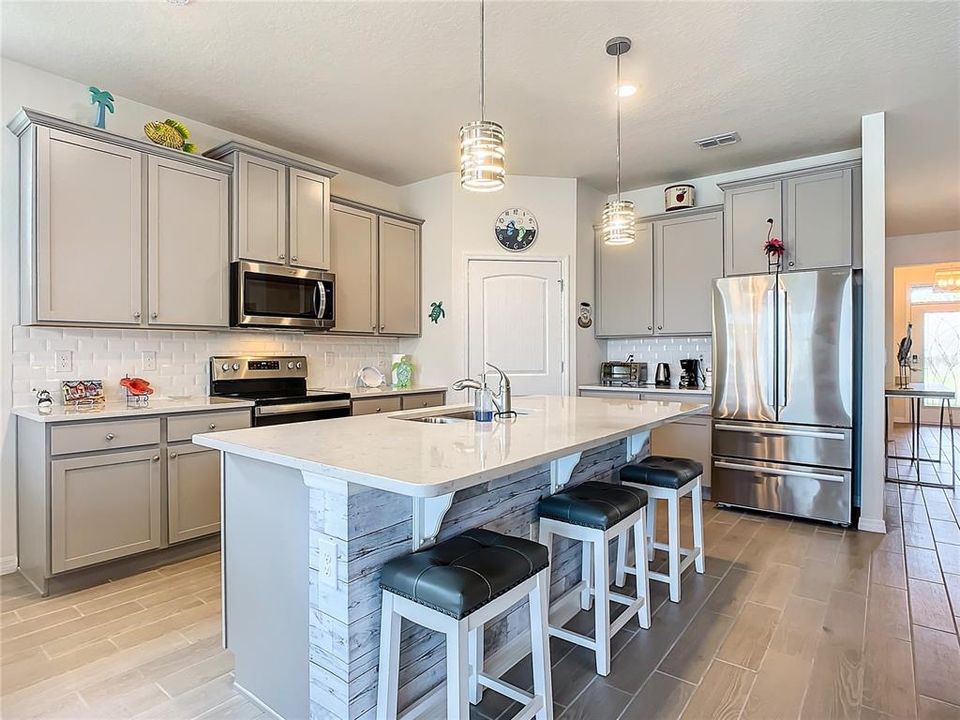 Quartz Counter, Island Kitchen., Pendant lights, French Door Refrigerator