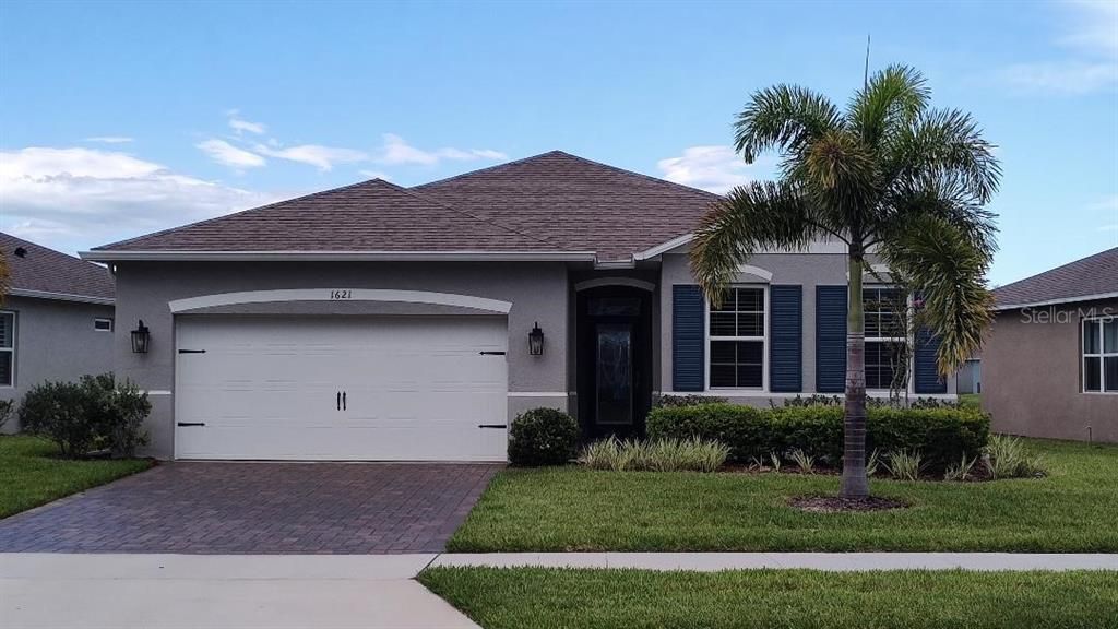 Front with Foxtail Palms and Paver Drive