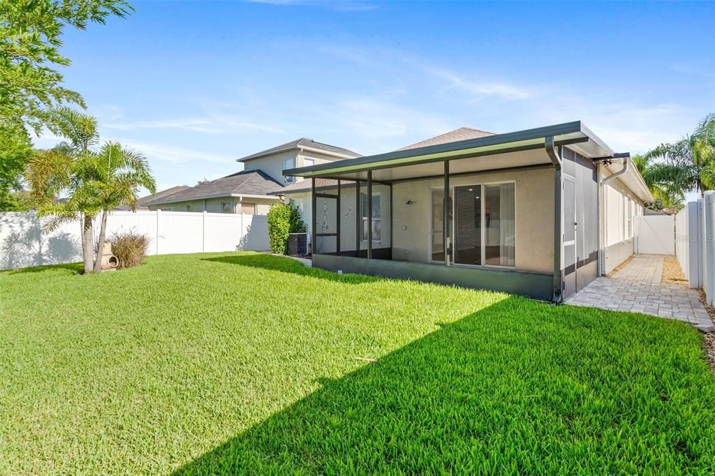 Rear Yard Featuring 6 ft Privacy Vinyl Fence & Custom Pavers