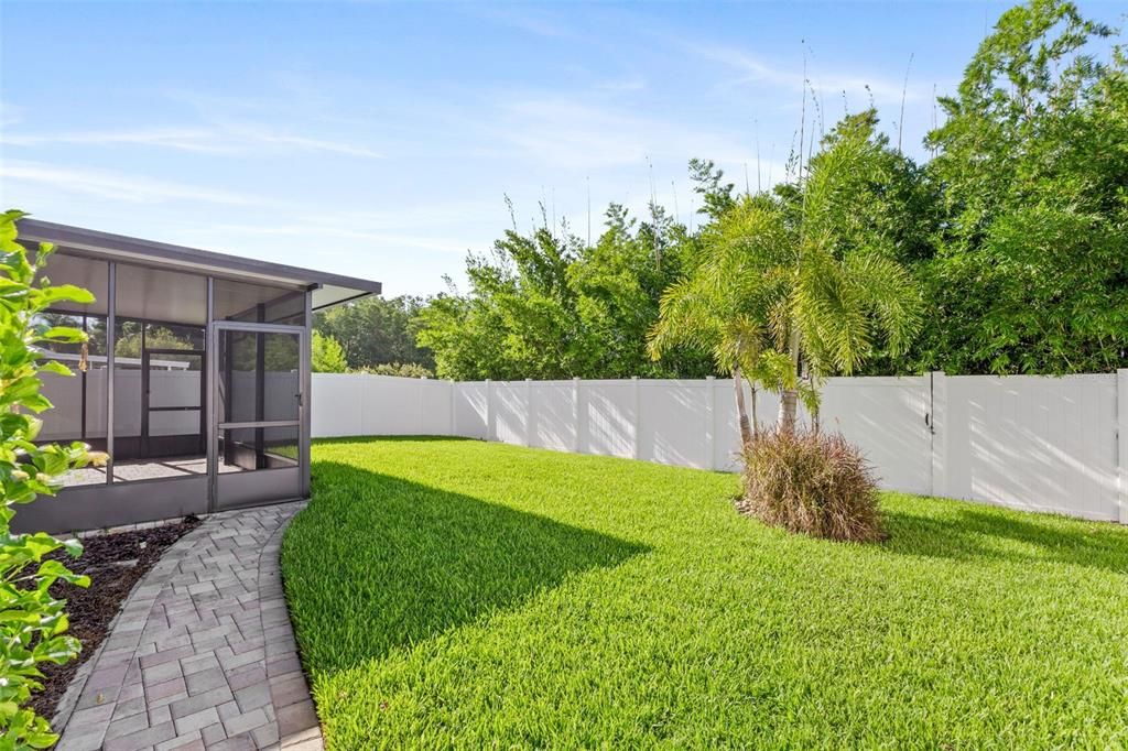 Rear Yard Featuring 6 ft Privacy Vinyl Fence & Custom Pavers