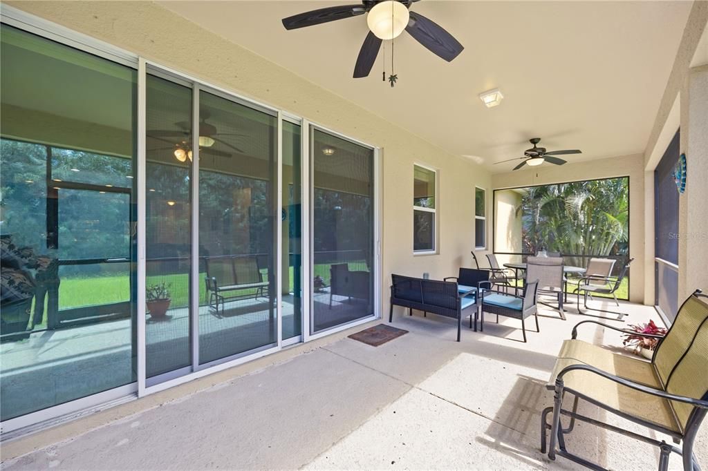 Screened in, lanai with outdoor ceiling fans and gas line hookup for an outdoor grill, is spacious creating an outdoor tranquil setting for frequent wildlife sightings.