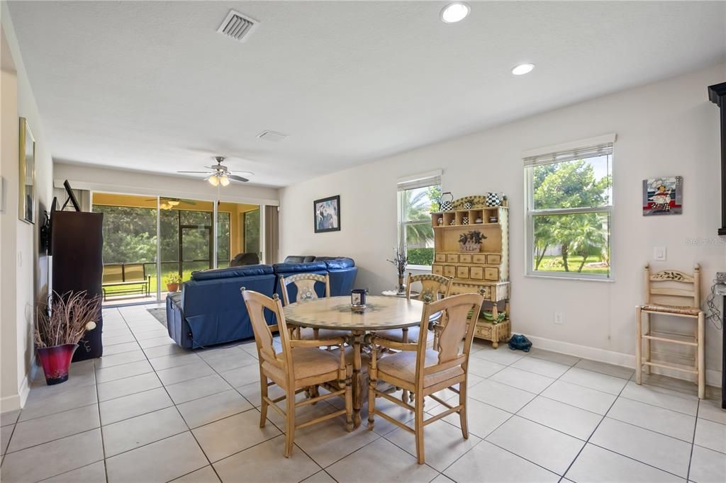 From the foyer, step into the open floor layout connecting the living room to dining and kitchen area