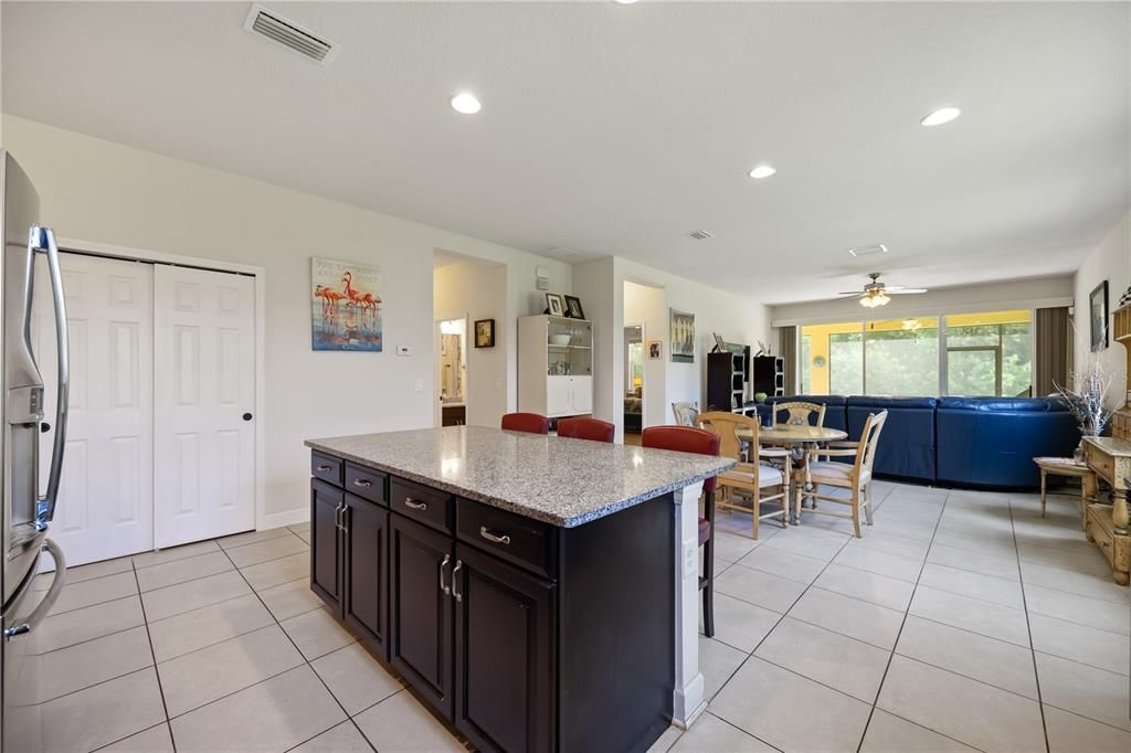 Kitchen overlooks dining space and living area