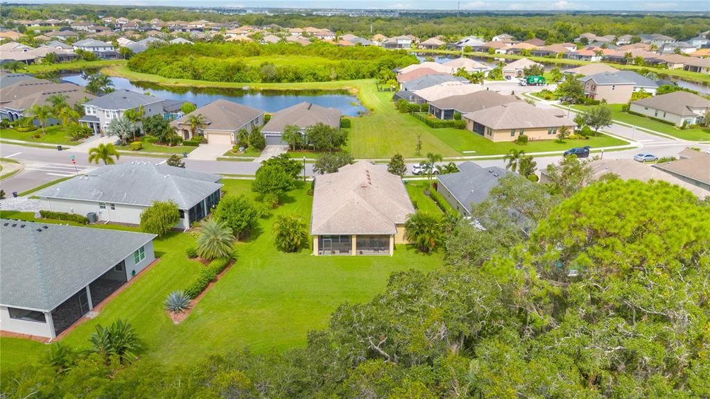 Home ensures a lot of privacy surrounded by lush Florida landscaping and a nature preserve behind home