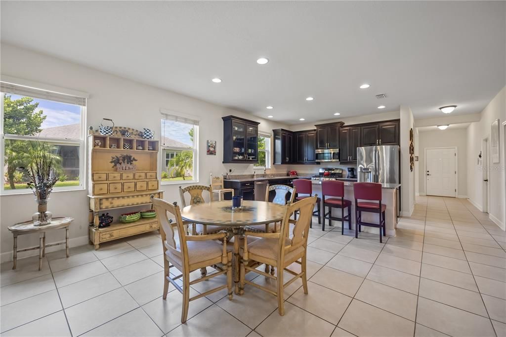 Informal dining area in the center of open floor plan perfect for creating that sense of togetherness