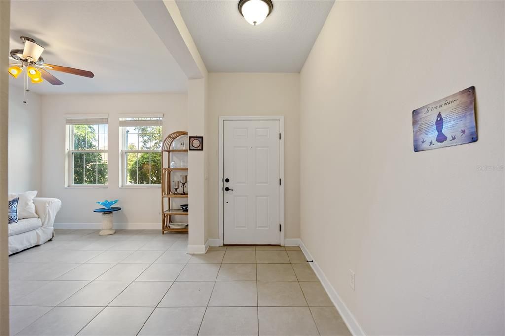 Front foyer with open Florida room, is perfect for a den/office. Ceramic tile throughout home except bedrooms.