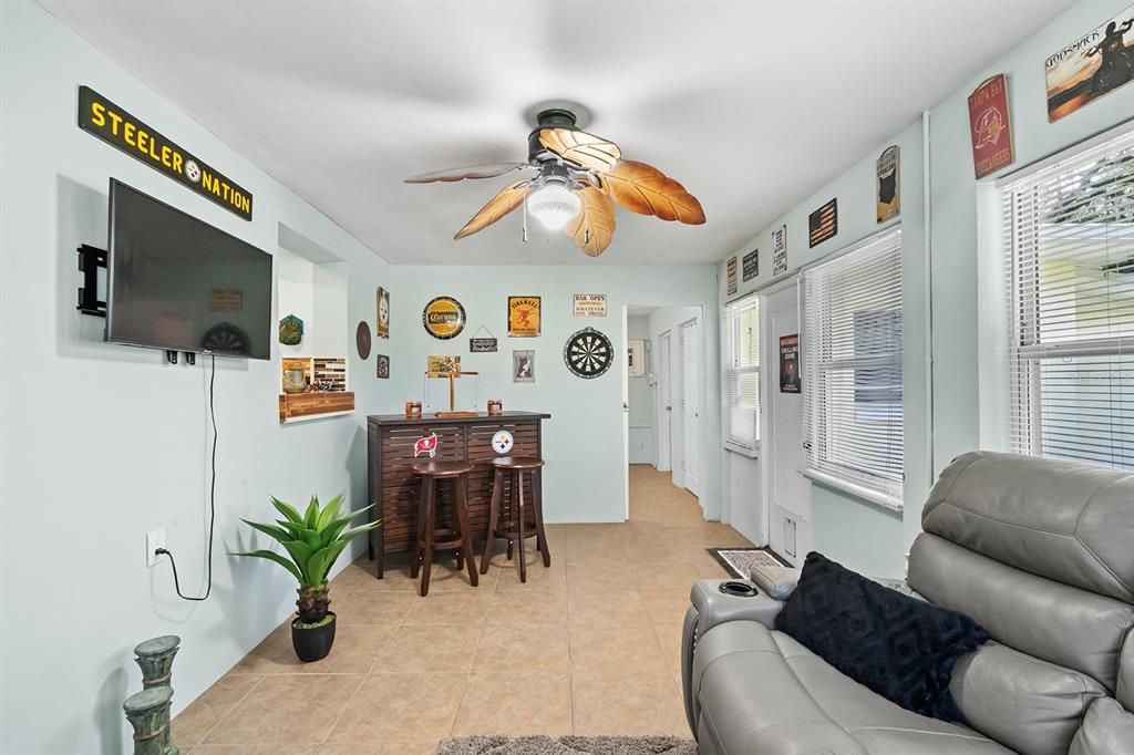 Enclosed Florida Room with entry into the 3rd bedroom.