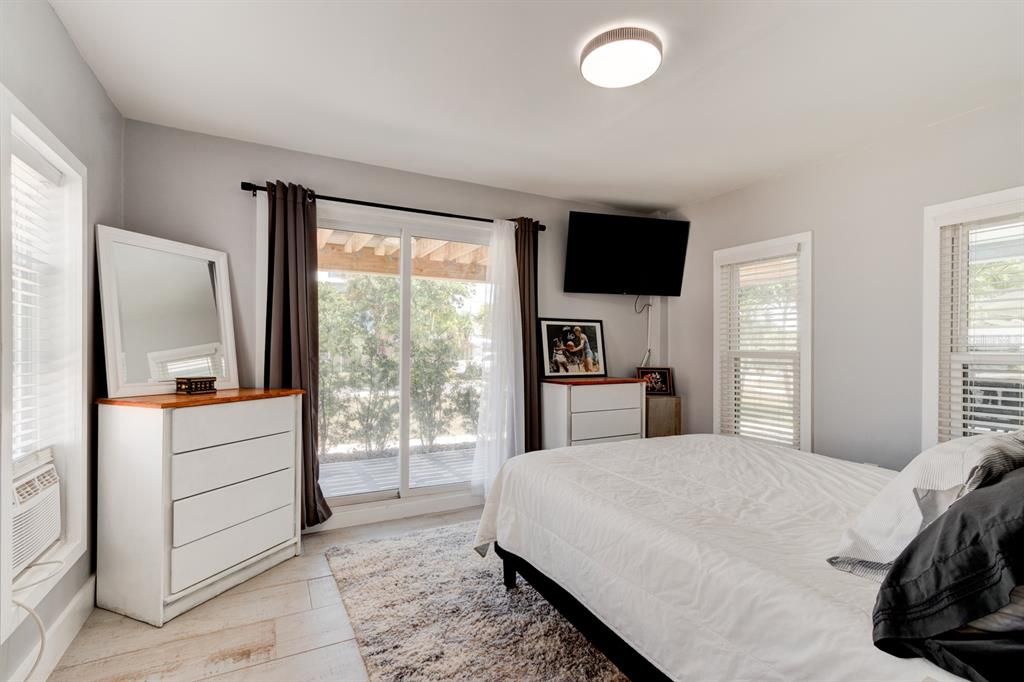 Apartment Bedroom with Sliding Glass Doors Leading to Patio