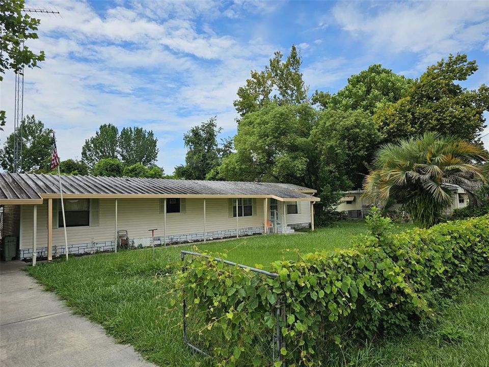 Front of house from fenced driveway