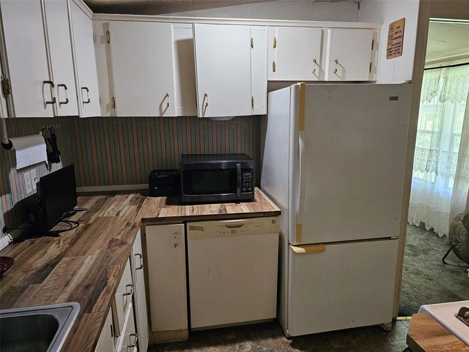 Kitchen wall with refrigerator