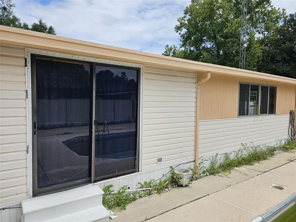 Back of house Sliding door to Living room