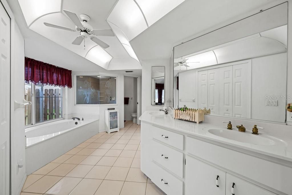 Primary bathroom with separate shower, tub and dual sinks.