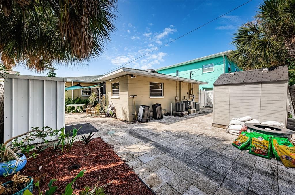 LARGER UNIT'S PATIO, RESIN SHED, GARDEN & WALLY WATT