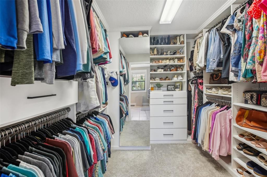 Primary closet with customized shelving/drawers