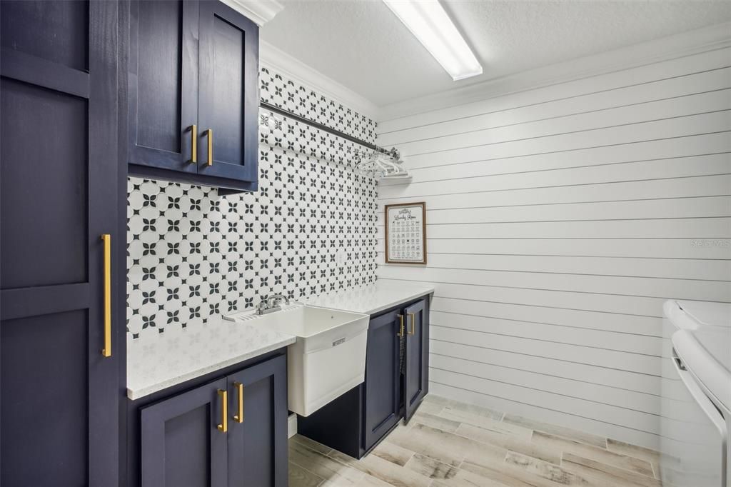 Upstairs Laundry/utility room with customized cabinetry