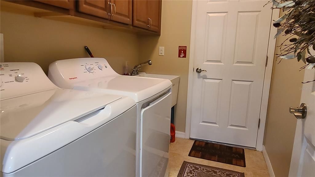 The washer and dryer are both brand new (as of 7/26/24) and the laundry room leads to the garage from the kitchen.