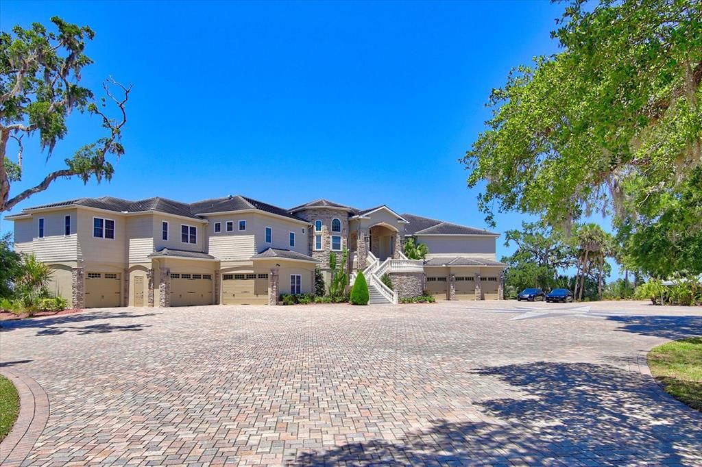 Front Exterior - Lower level features nearly 9,000 sf of garage/storage space with 12 garage doors