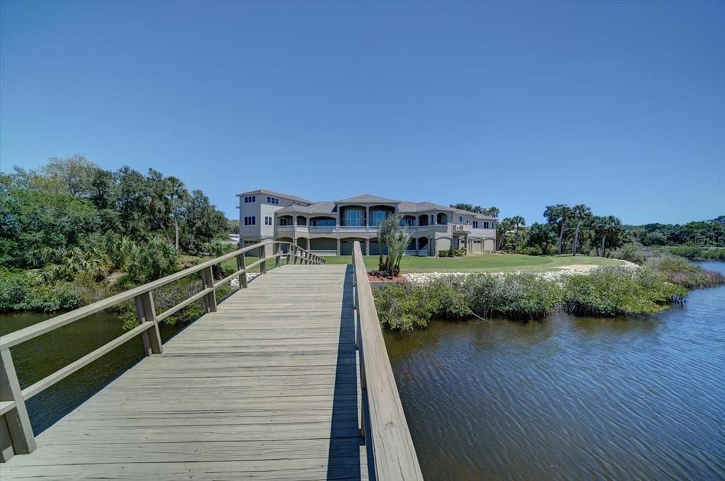 Rear Exterior and Bridge to Private Island