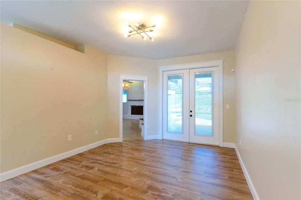 Living Room - french doors to the pool patio