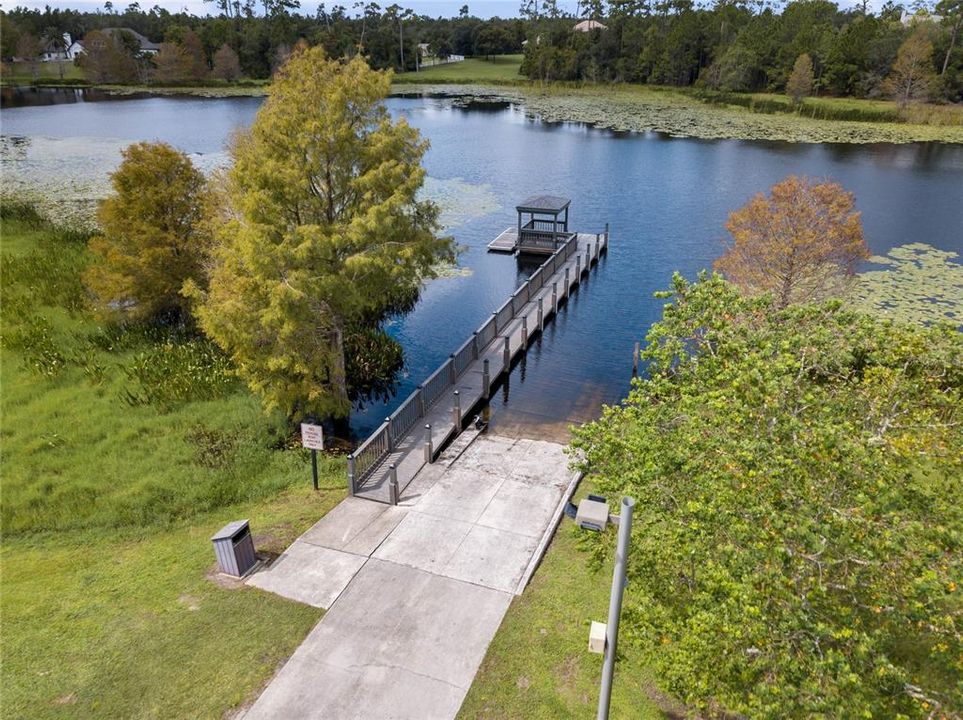 Private community lake showing dock/boat ramp