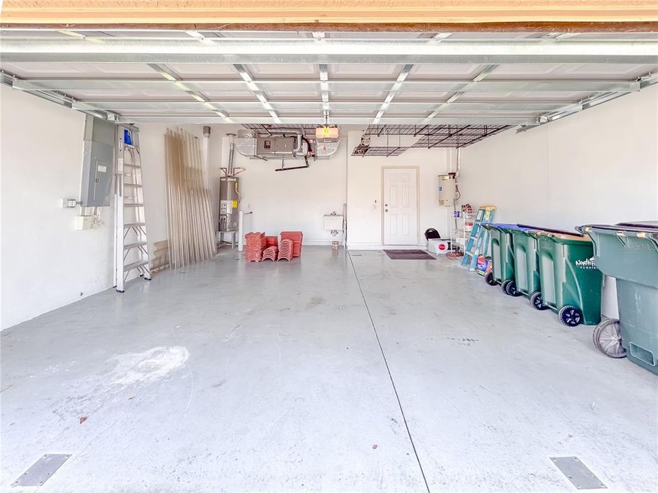 Garage with ceiling storage rack system