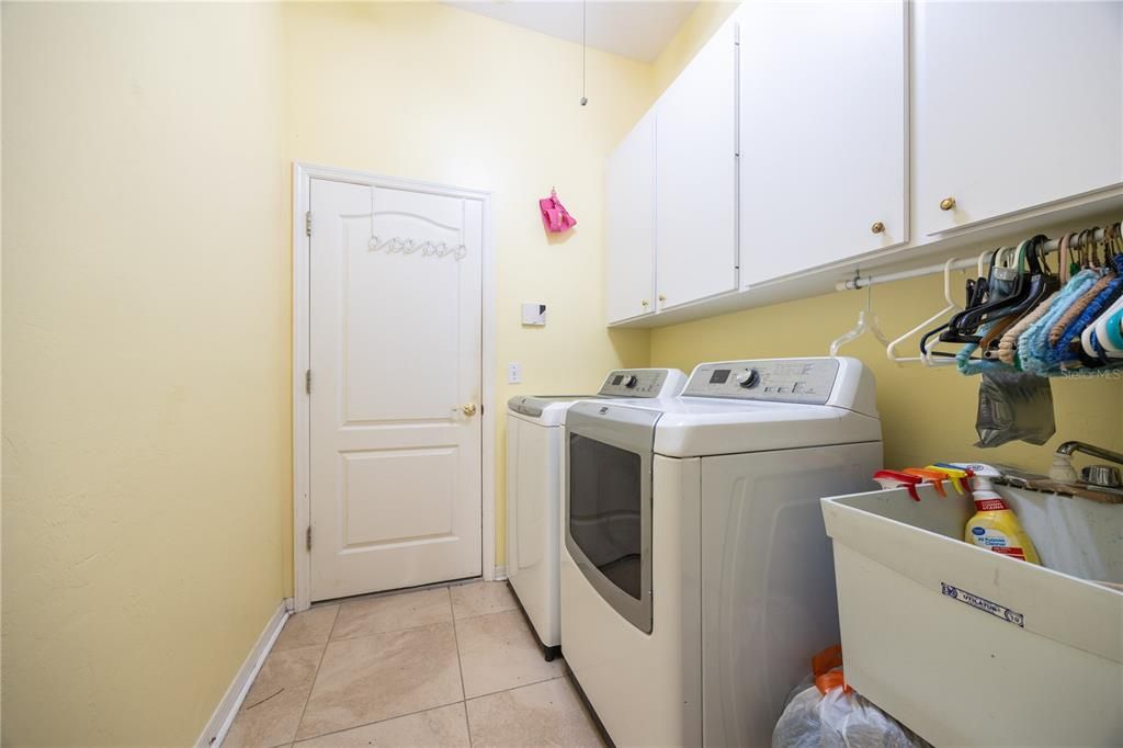 Laundry area leading into garage