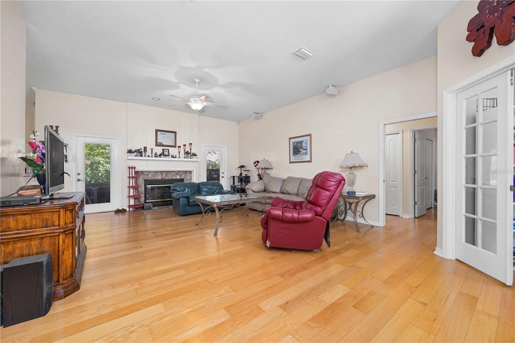 10 foot ceilings, wood burning fireplace, and wood floors.