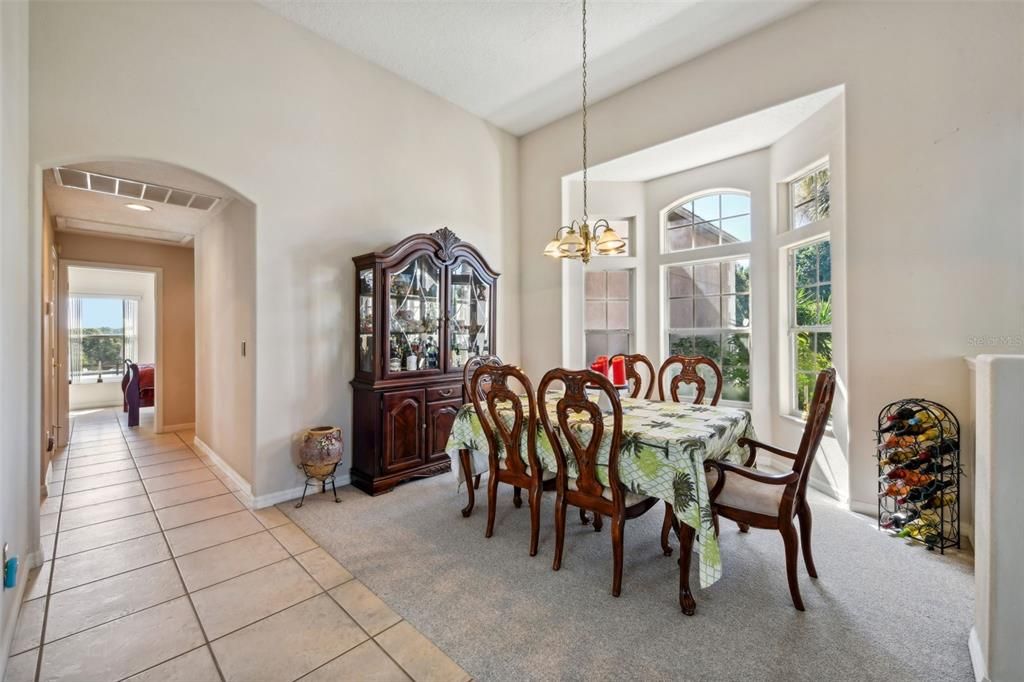 Formal Dining and the Hallway leading to the 2nd and 3rd Bedrooms and 2nd Full Bathroom. The Laundry Room and Garage are also down there