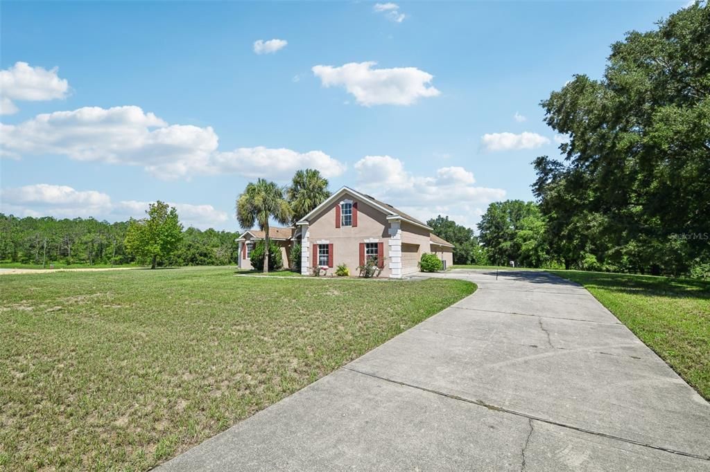 The Lot is COMPLETELY PRIVATE, the Home is PERFECTLY POSITIONED in the MIDDLE OF THE LOT and the LONG DRIVEWAY under a CANOPY OF TREES is the PERFECT ENTRANCE to the HOME!