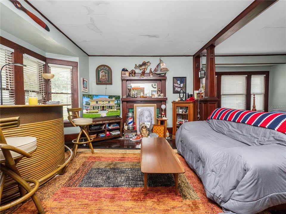 Apt 1 Livingroom w/ bay window and decorative fireplace