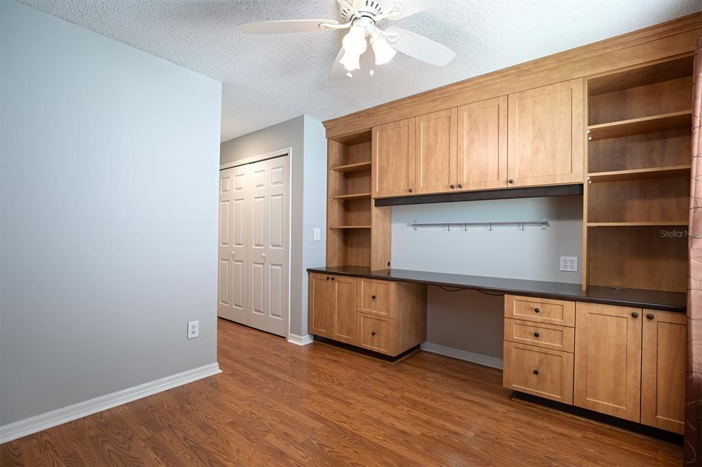 2nd bedroom has so much functionality. Built-in office system including desk and plenty of storage.