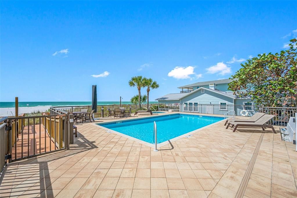 Heated pool, paver pool deck overlooking the beach