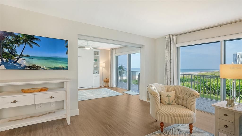 Guest bedroom incorporates a glass privacy slider to separate the bedroom from the great room.