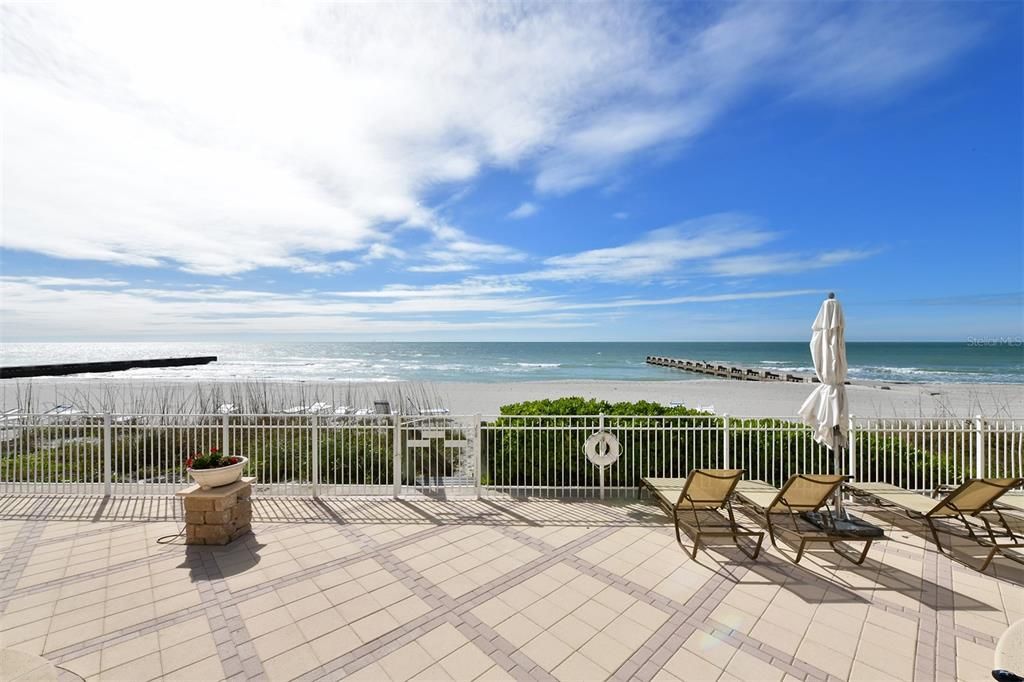 The pool area gives way to a pristine white sand beach and Gulf of Mexico.