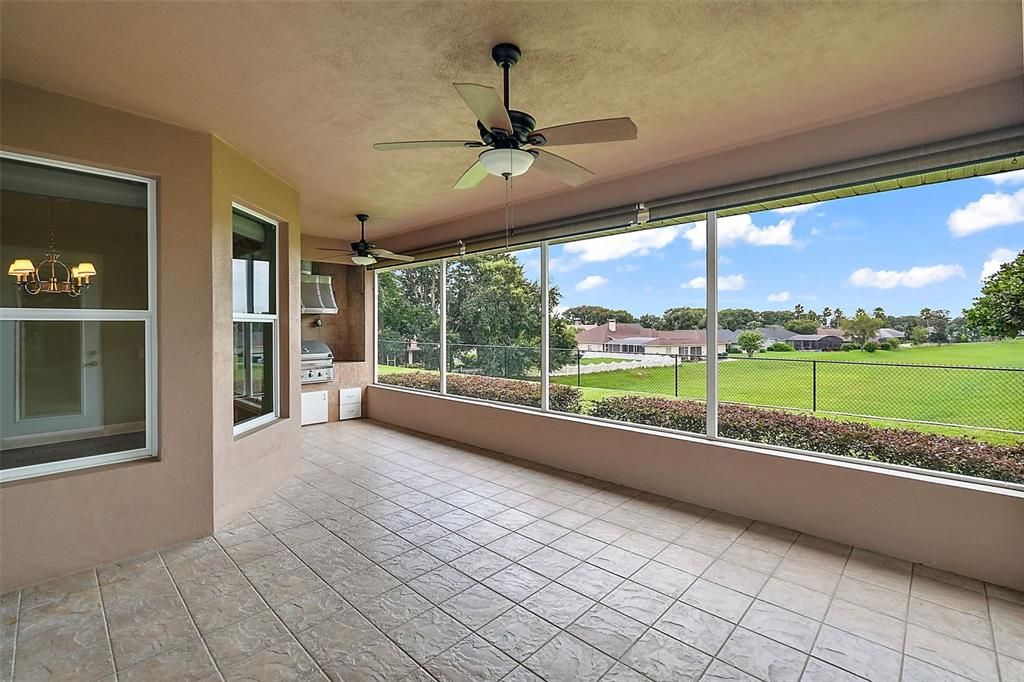 Tiled lanai with incredible backyard views