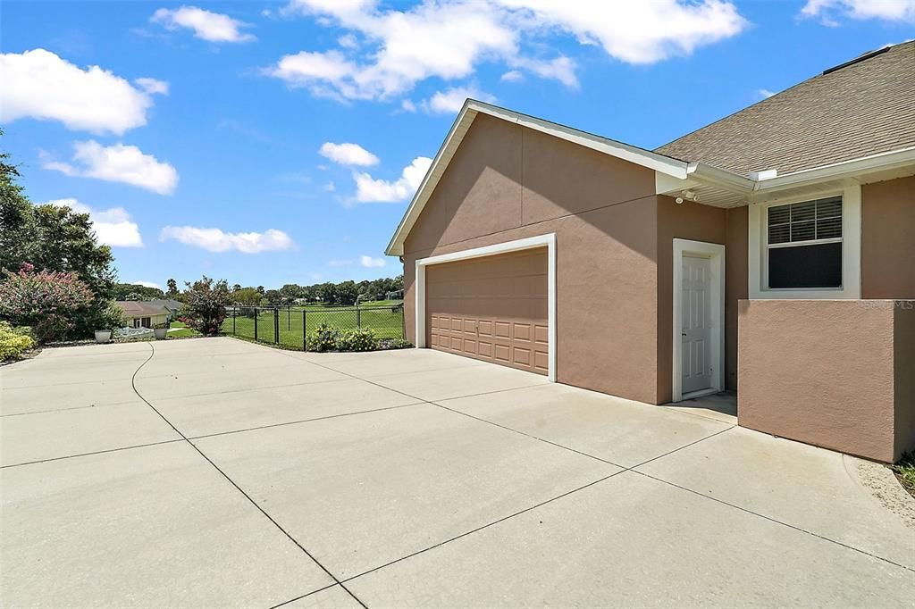 Side entry two-car garage and parking pad