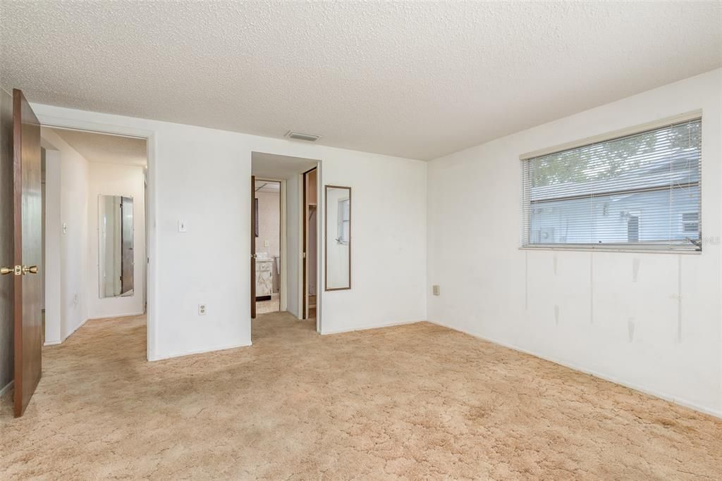 Master Bedroom with view of bathroom & walk-in closet