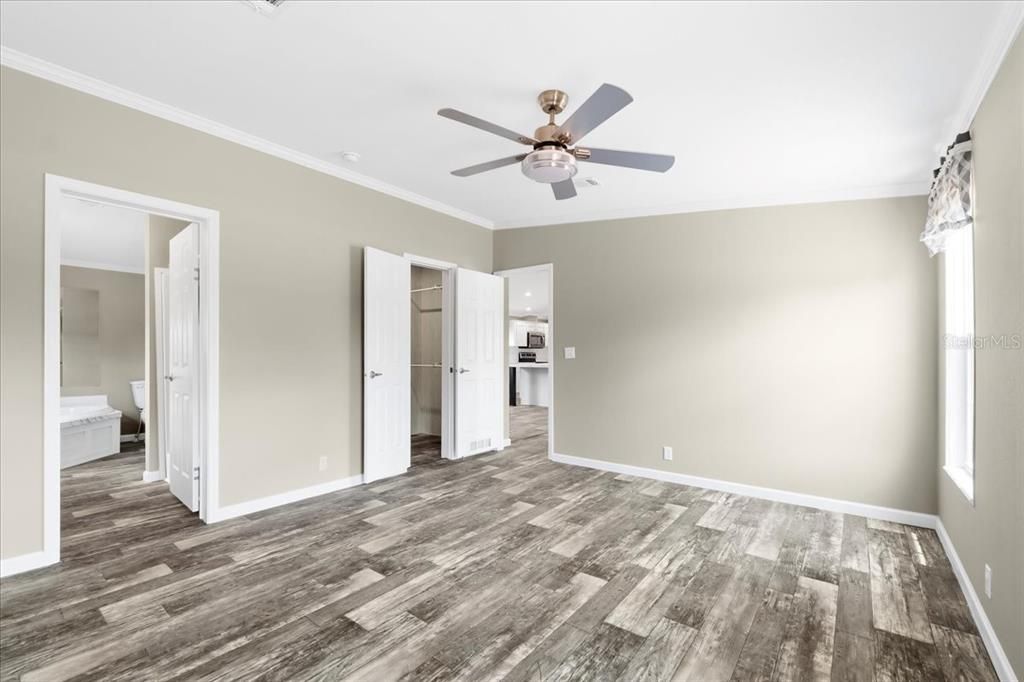 Primary Bedroom w/ view of En-Suite & Walk-In Closet