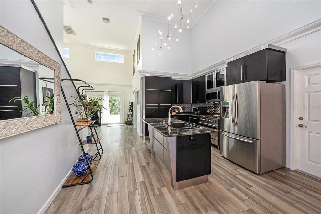 Perfect custom-built kitchen with European cabinets (tower pull outs), Labradorite countertops and a professional Smeg 9 burner gas stove/oven!