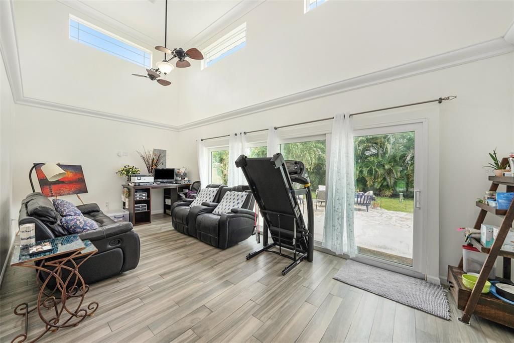 High ceilings. 16' wide patio glass hurricane sliders in the living room leading out to your large, fenced back yard