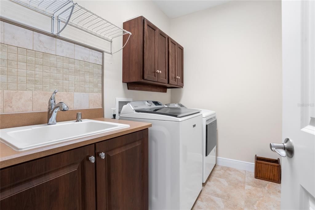 Laundry room with new cabinets and backsplash tile