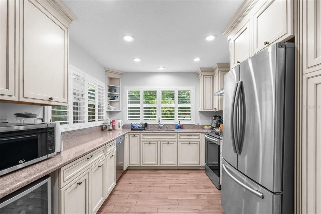 Upgraded kitchen with lovely views of your backyard. Check out that wine refrigerator!