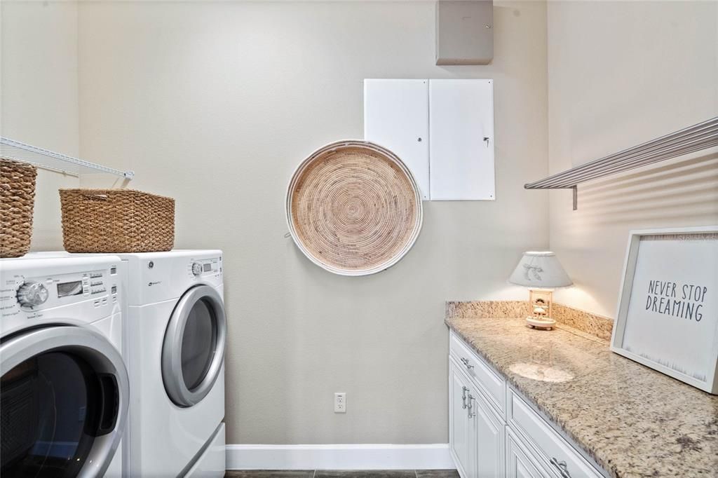 Upstairs Laundry Room with much storage space and FOLDING COUNTER