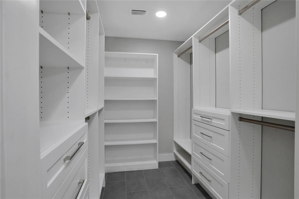 Primary walk-in closet designed by Closets by Design